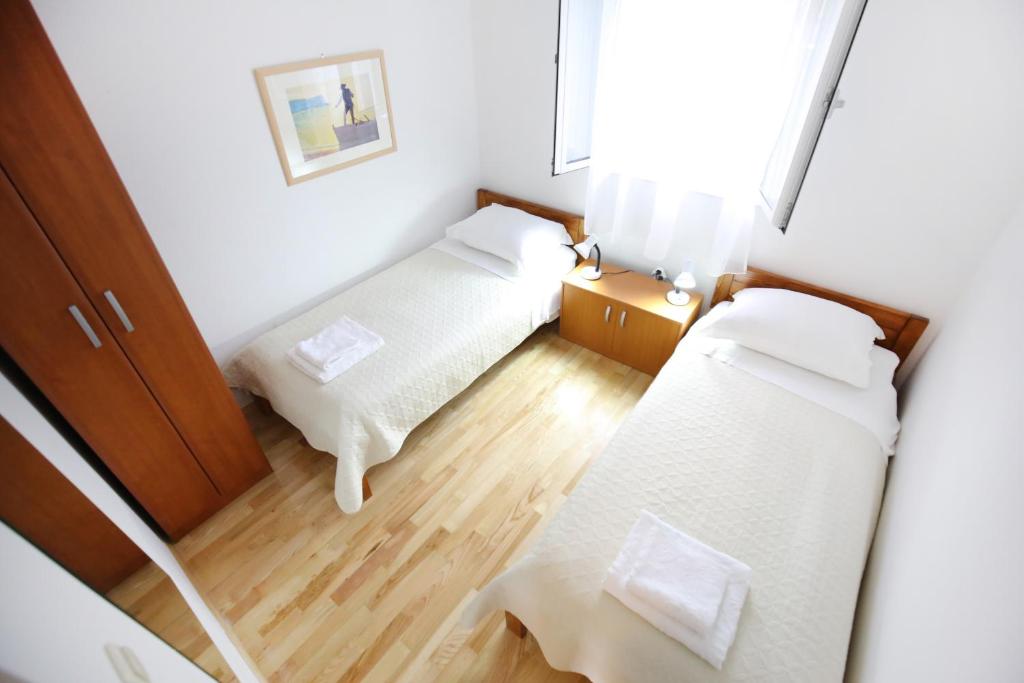 Łóżko lub łóżka w pokoju w obiekcie Villa Goga