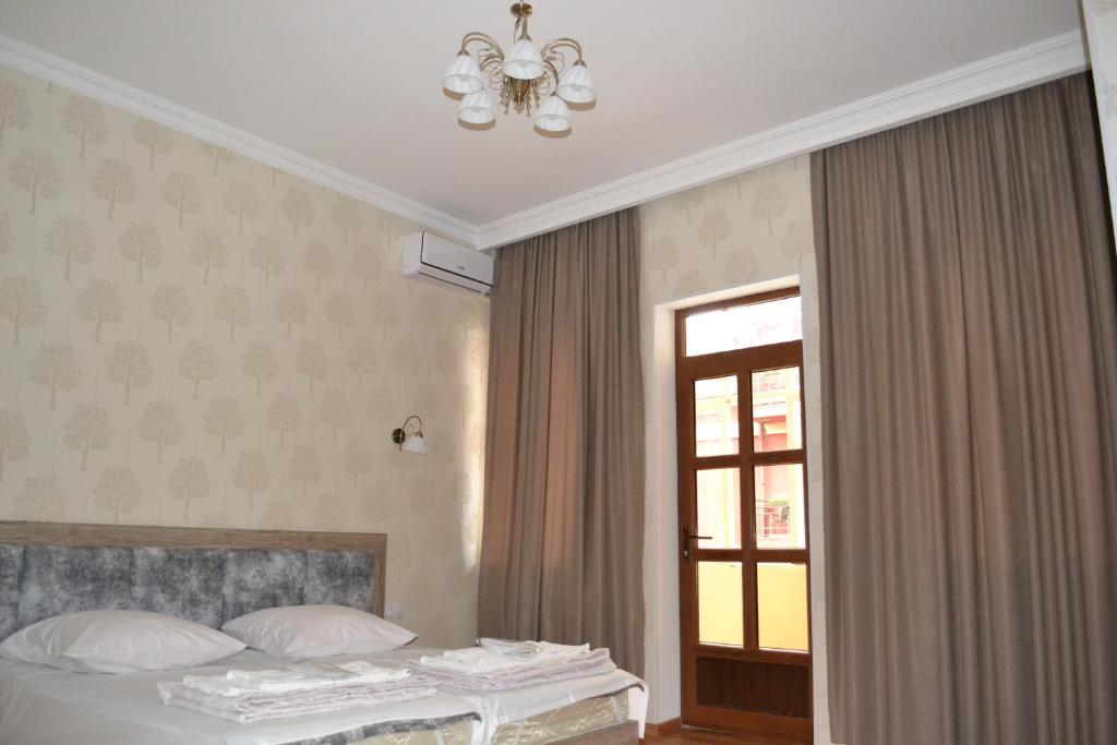 Postel nebo postele na pokoji v ubytování Guest House Rafael