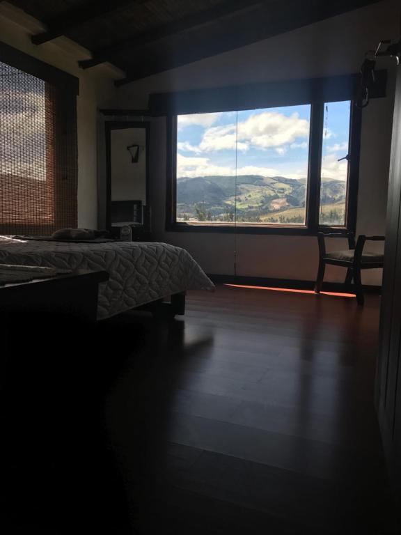 Postel nebo postele na pokoji v ubytování Hostal Casa Lantana