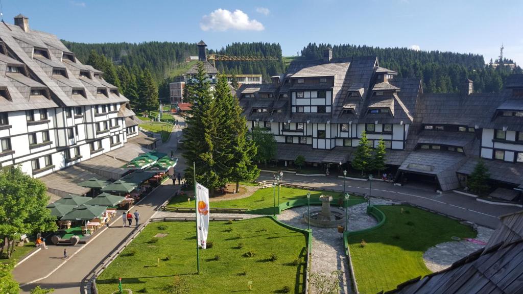 an aerial view of a town with buildings and a park at Apartments Mozaik in Kopaonik