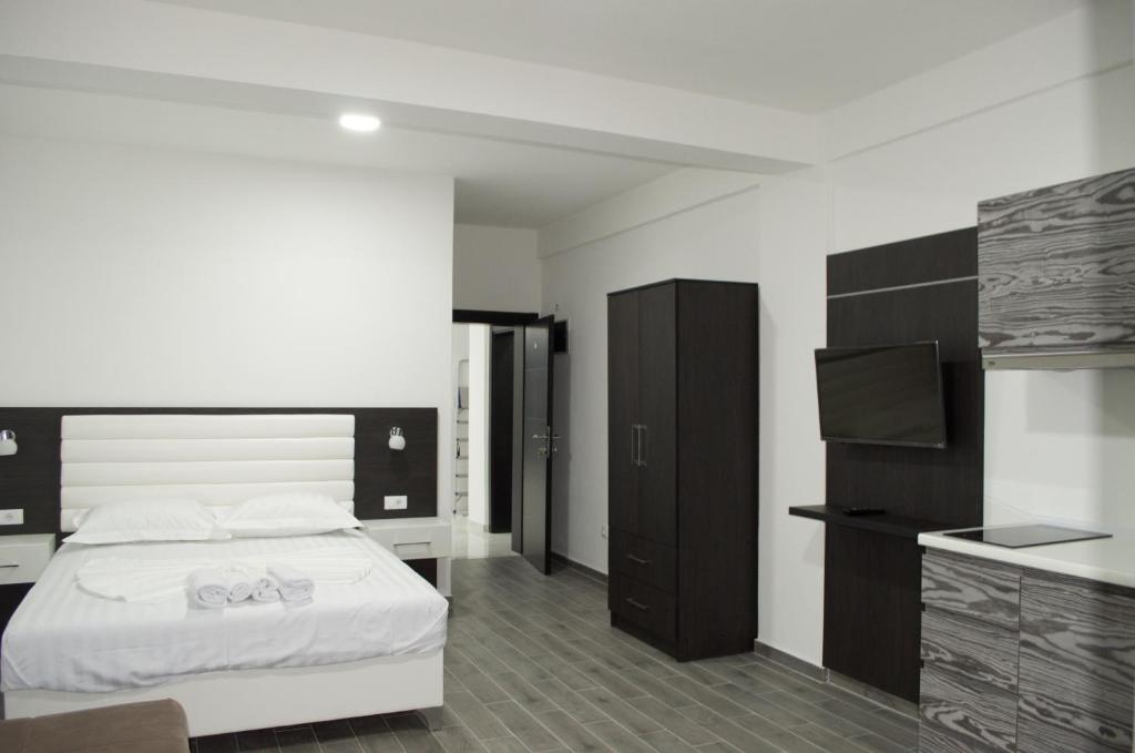 Postel nebo postele na pokoji v ubytování Flo Apartments