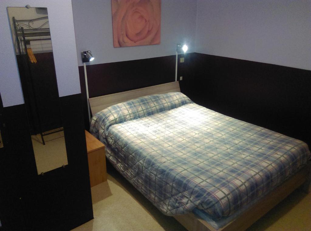 Postel nebo postele na pokoji v ubytování Hotel le Rallye