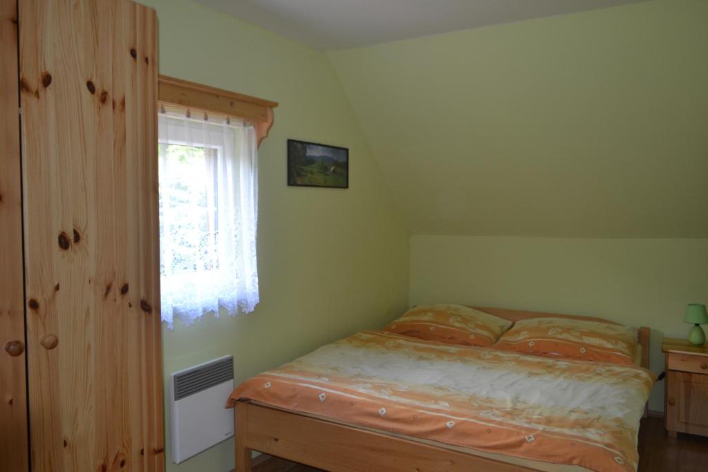 Postel nebo postele na pokoji v ubytování Chaty pod Knížecí, Trojanovice
