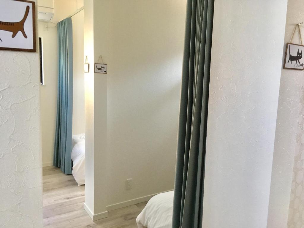 Postel nebo postele na pokoji v ubytování Guesthouse ORI ORI