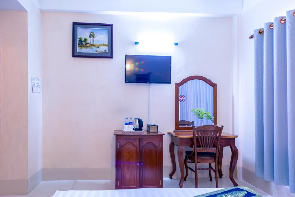 TV a/nebo společenská místnost v ubytování Siem Reap Riverside Hotel