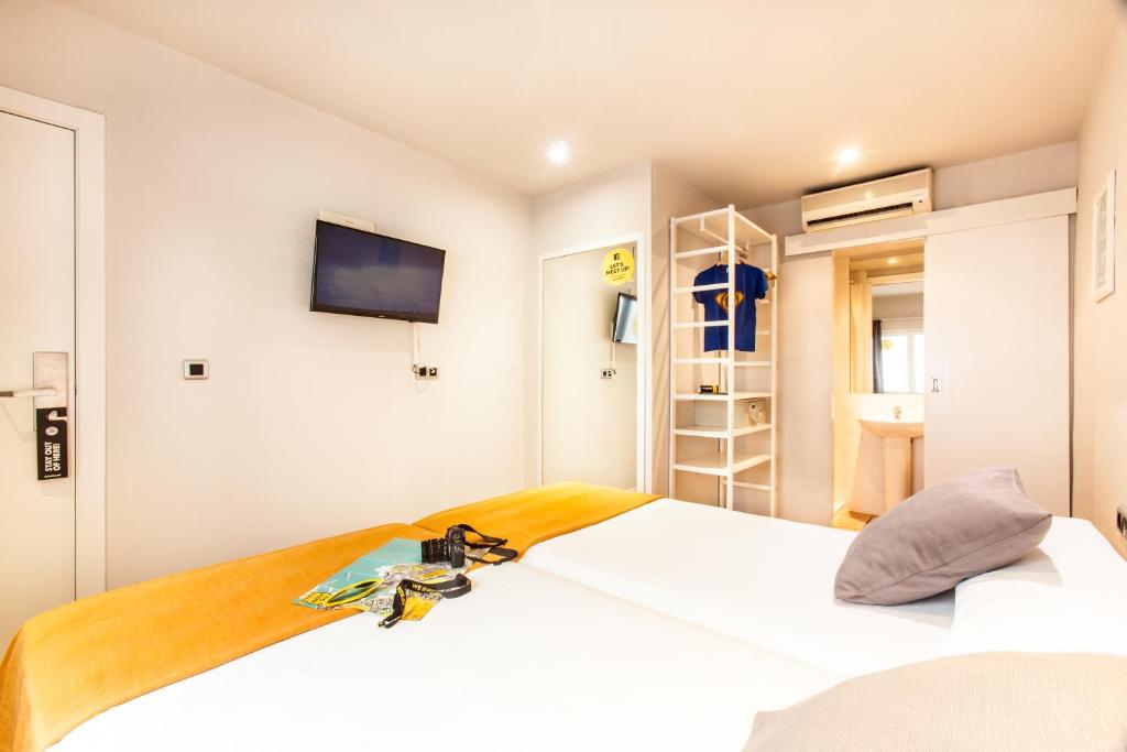 Postel nebo postele na pokoji v ubytování Ten Hostel