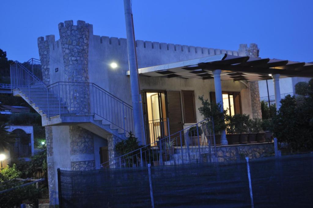 a house with a staircase in front of it at night at Santa Maria in Cittadella del Capo