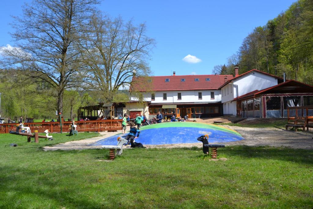 a group of people playing in a pool in a park at Zrcadlová Koza in Turnov