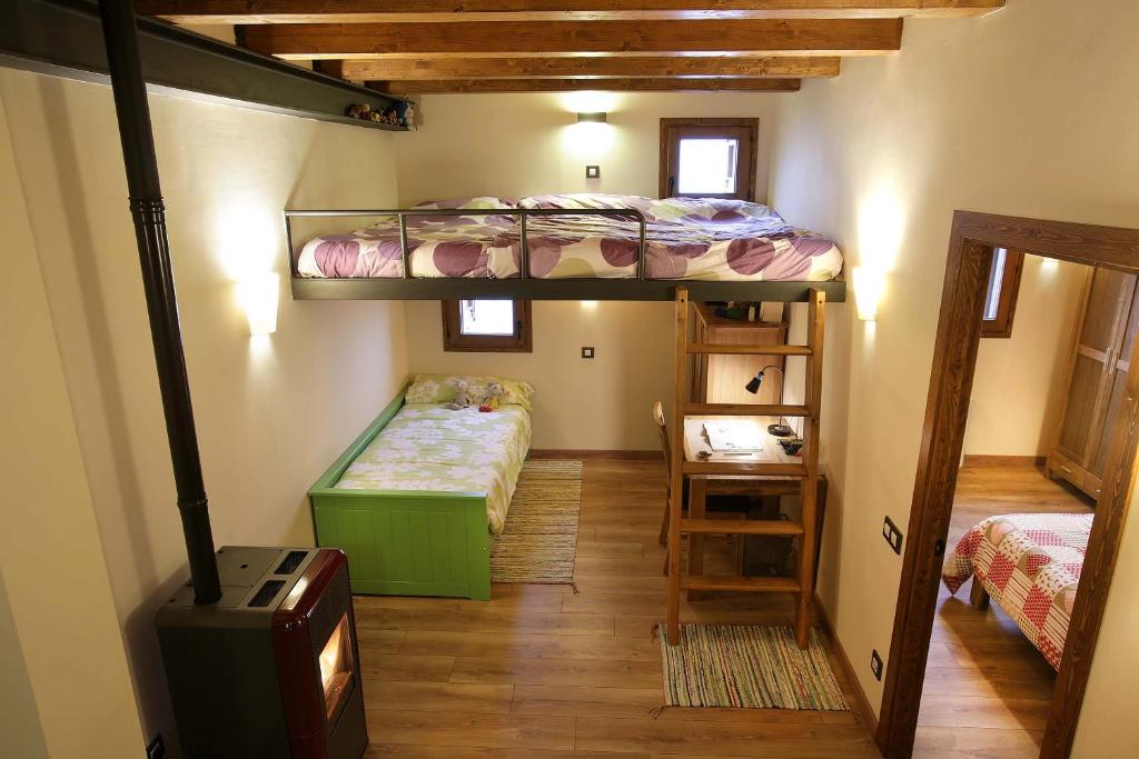 Postel nebo postele na pokoji v ubytování Cal Sansa