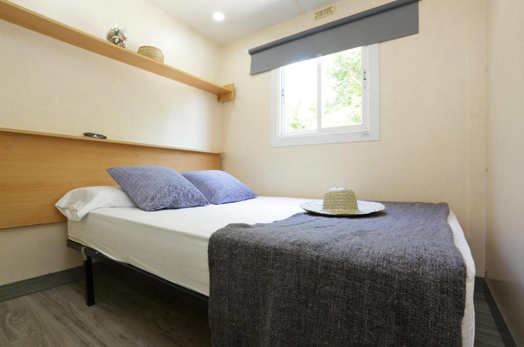 Postel nebo postele na pokoji v ubytování Camping Sènia Riu