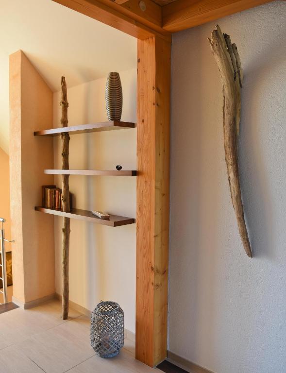 a room with wooden shelves on the wall at La Villa Esterel &amp; SPA in Village-Neuf