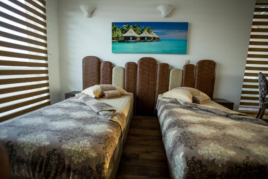 Postel nebo postele na pokoji v ubytování Boutique Apart Hotel Versis