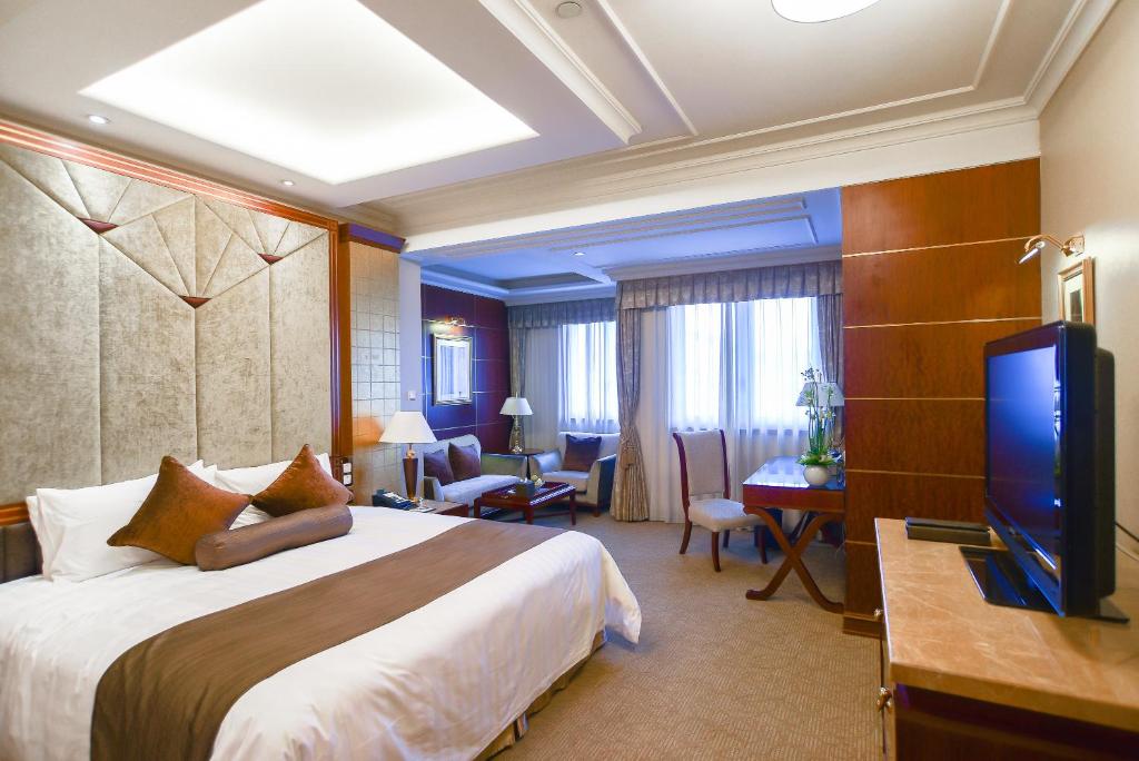 Postel nebo postele na pokoji v ubytování Xijiao State Guest Hotel