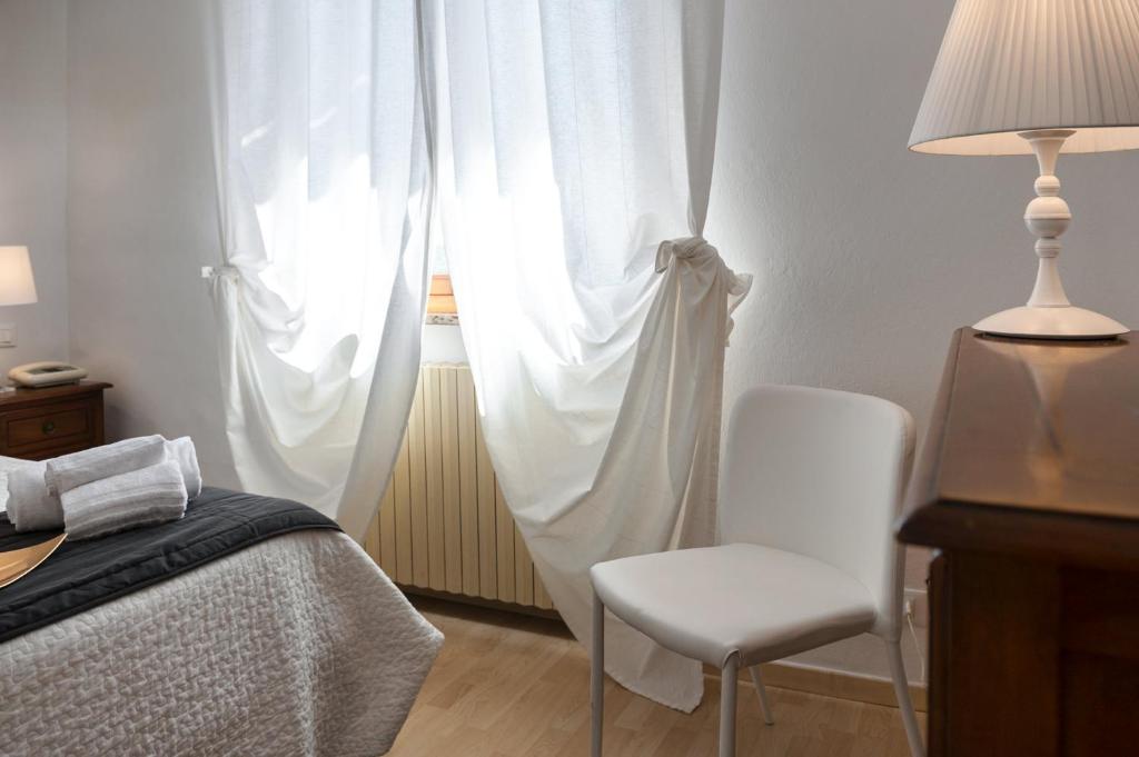 Postel nebo postele na pokoji v ubytování Hotel Porta Romana di Luce Hotels