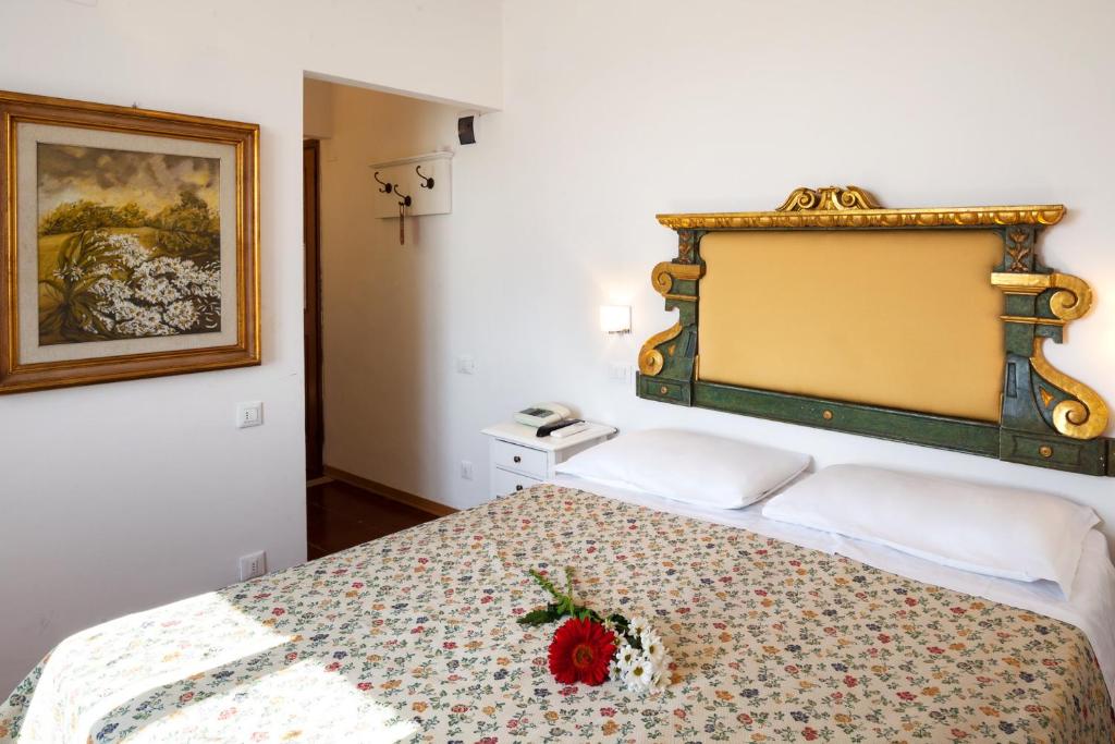 Postel nebo postele na pokoji v ubytování Hotel Porta Romana di Luce Hotels