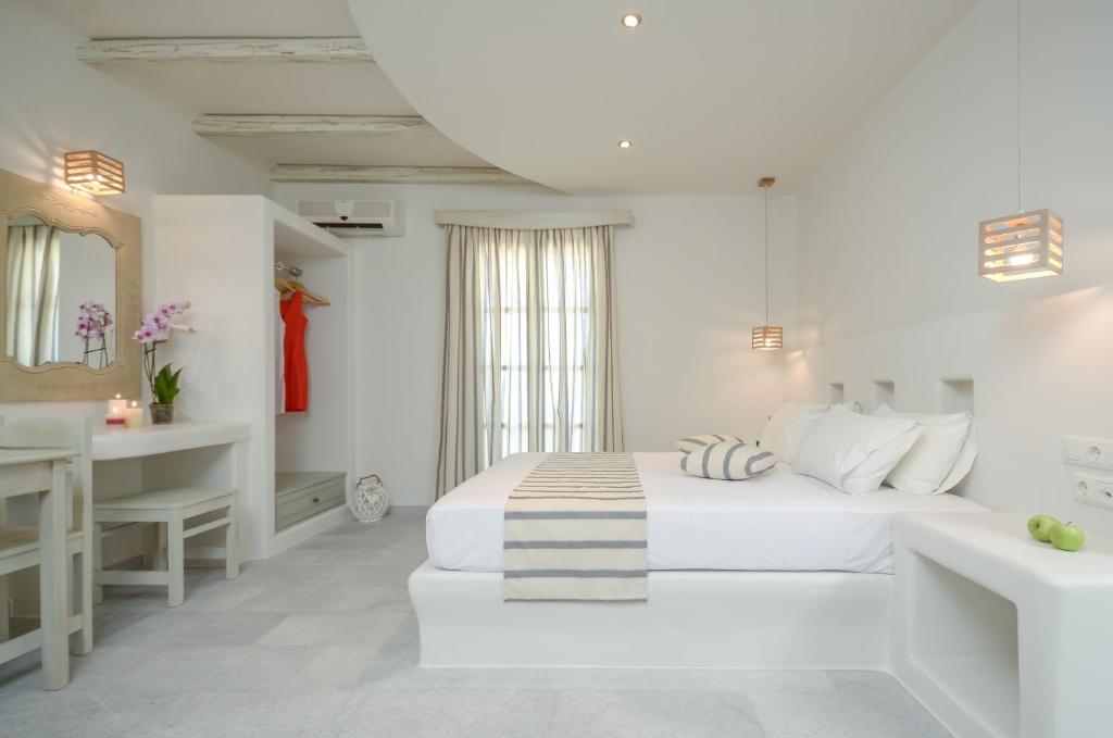 Postel nebo postele na pokoji v ubytování Agnadi Hotel