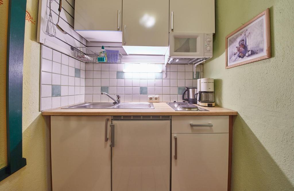 Kuchyň nebo kuchyňský kout v ubytování Appartements Alpin