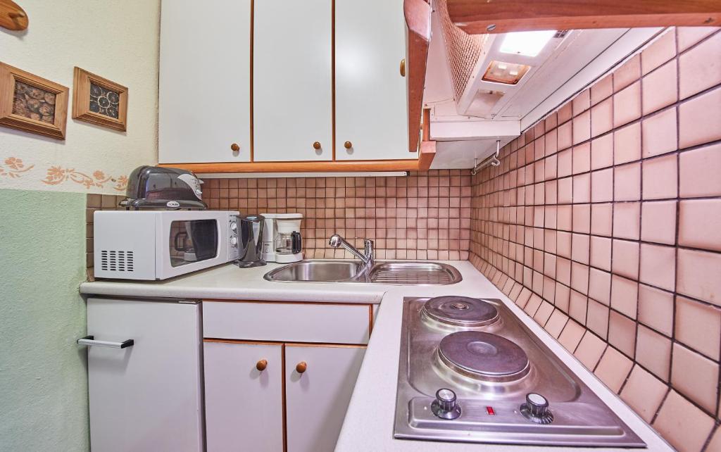 Kuchyň nebo kuchyňský kout v ubytování Appartements Alpin