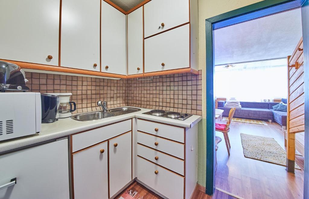Kuchyň nebo kuchyňský kout v ubytování Appartements Alpin