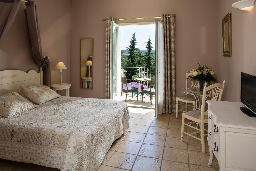 Postel nebo postele na pokoji v ubytování Hotel Restaurant Le Clos De Pradines