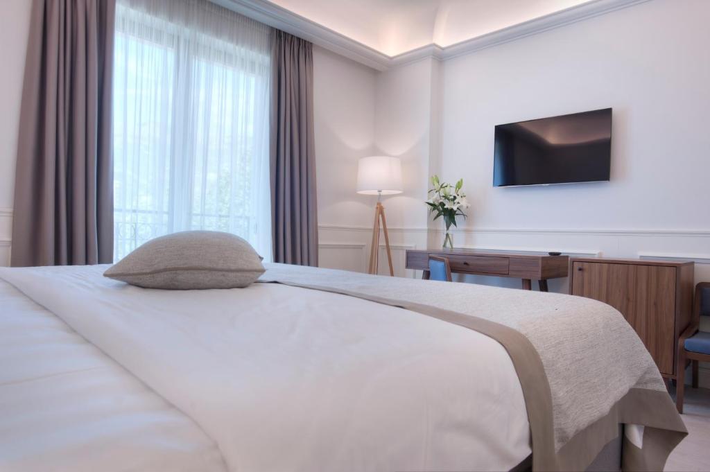 Posteľ alebo postele v izbe v ubytovaní Hotel Majestic