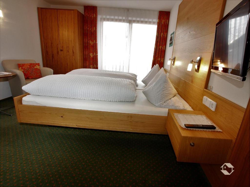 Postel nebo postele na pokoji v ubytování Gästehaus Wissler
