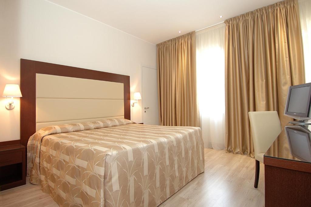 Posteľ alebo postele v izbe v ubytovaní Hotel Lugano Torretta