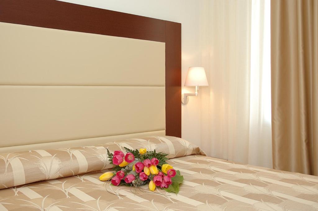 Posteľ alebo postele v izbe v ubytovaní Hotel Lugano Torretta