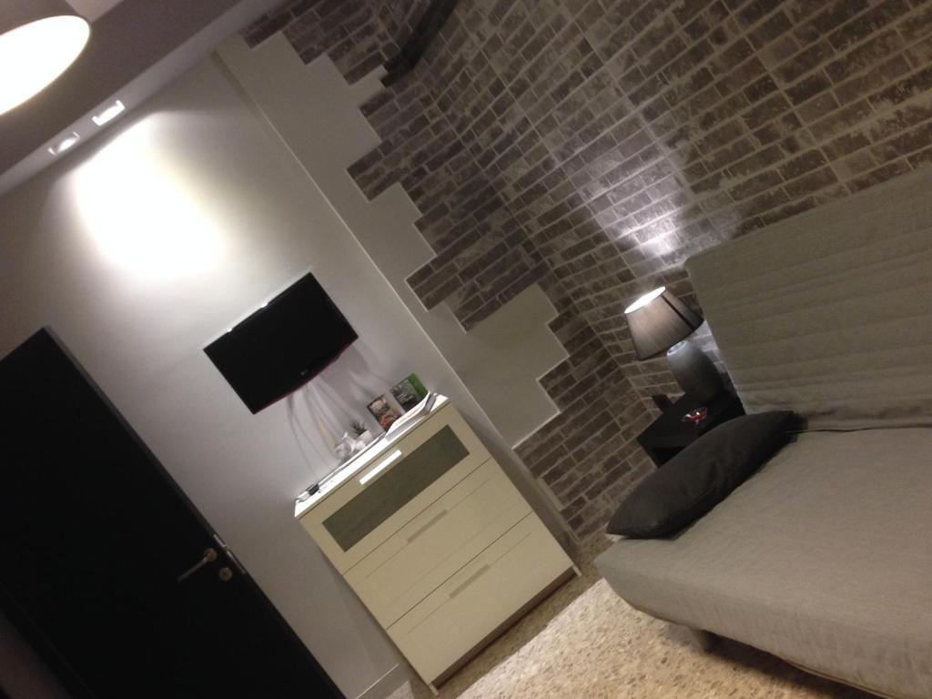 Televízia a/alebo spoločenská miestnosť v ubytovaní Guest House 38 Monopoli