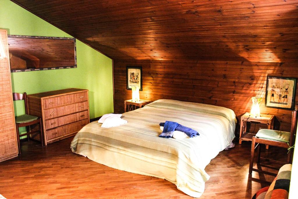 a bedroom with a bed with a stuffed animal on it at B&B Pian Savin in Giaveno