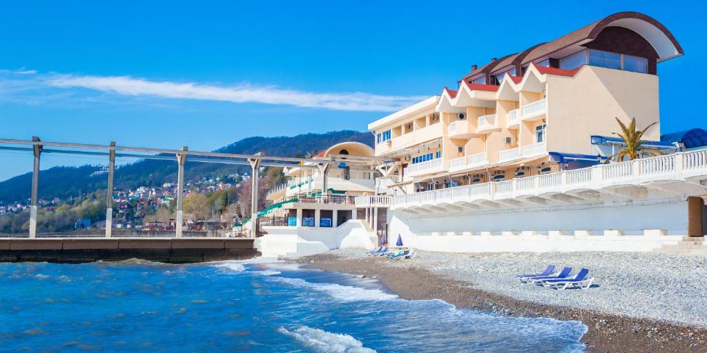 a hotel on the beach next to the water at Son y Morya in Sochi