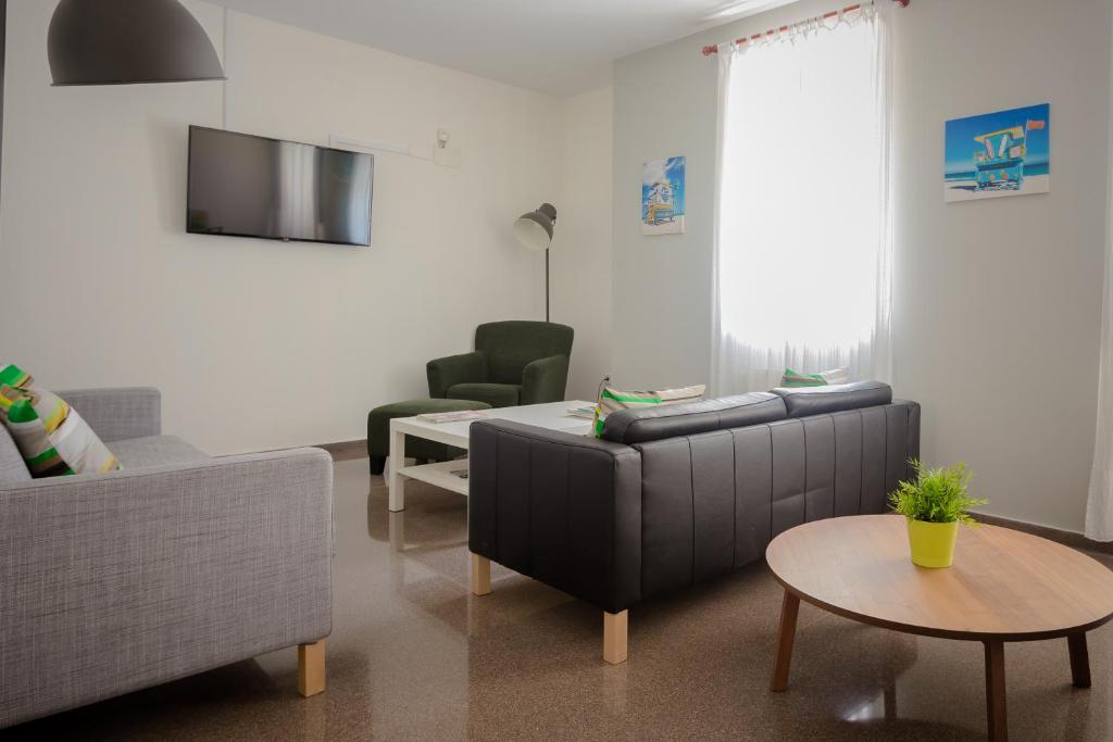 TV a/nebo společenská místnost v ubytování Hostal El Convent de Moncada
