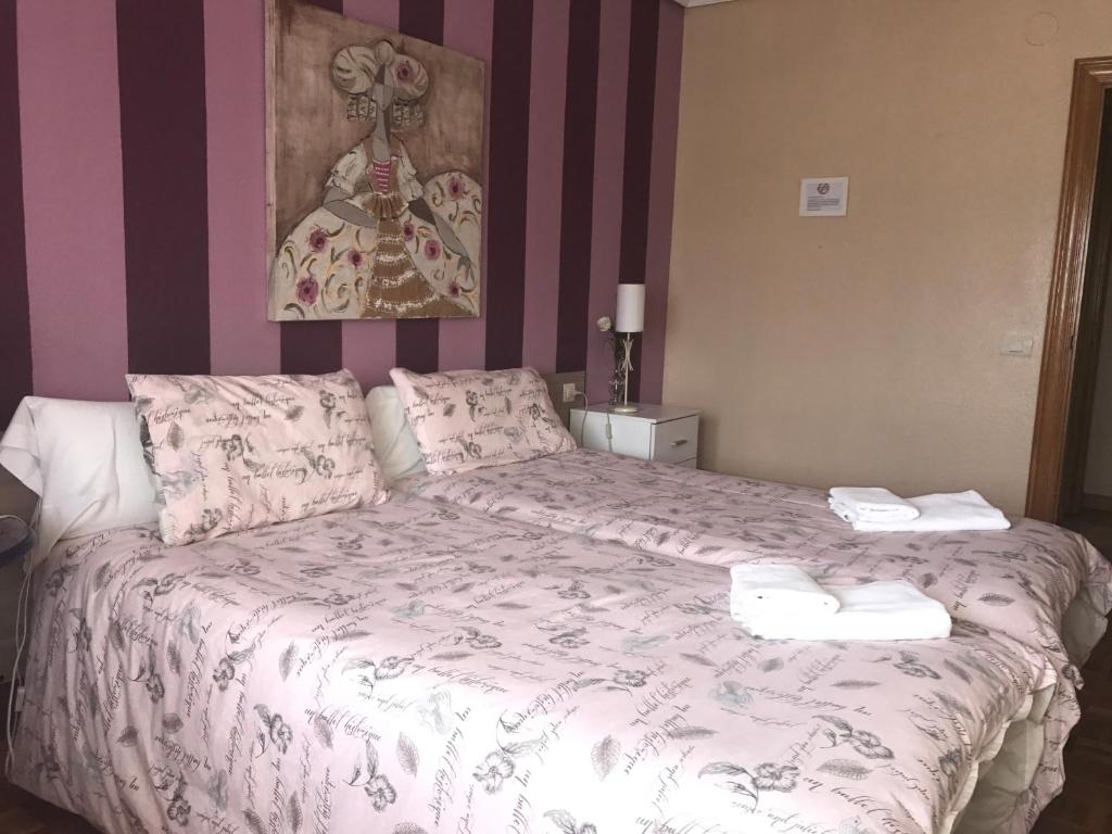 Postel nebo postele na pokoji v ubytování Alojamientos Olga