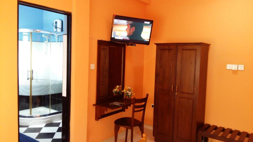 TV a/nebo společenská místnost v ubytování Basilico Homestay