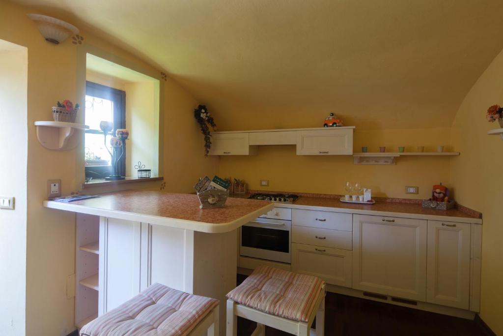 Kuchyň nebo kuchyňský kout v ubytování B&B La Pulce Dorata
