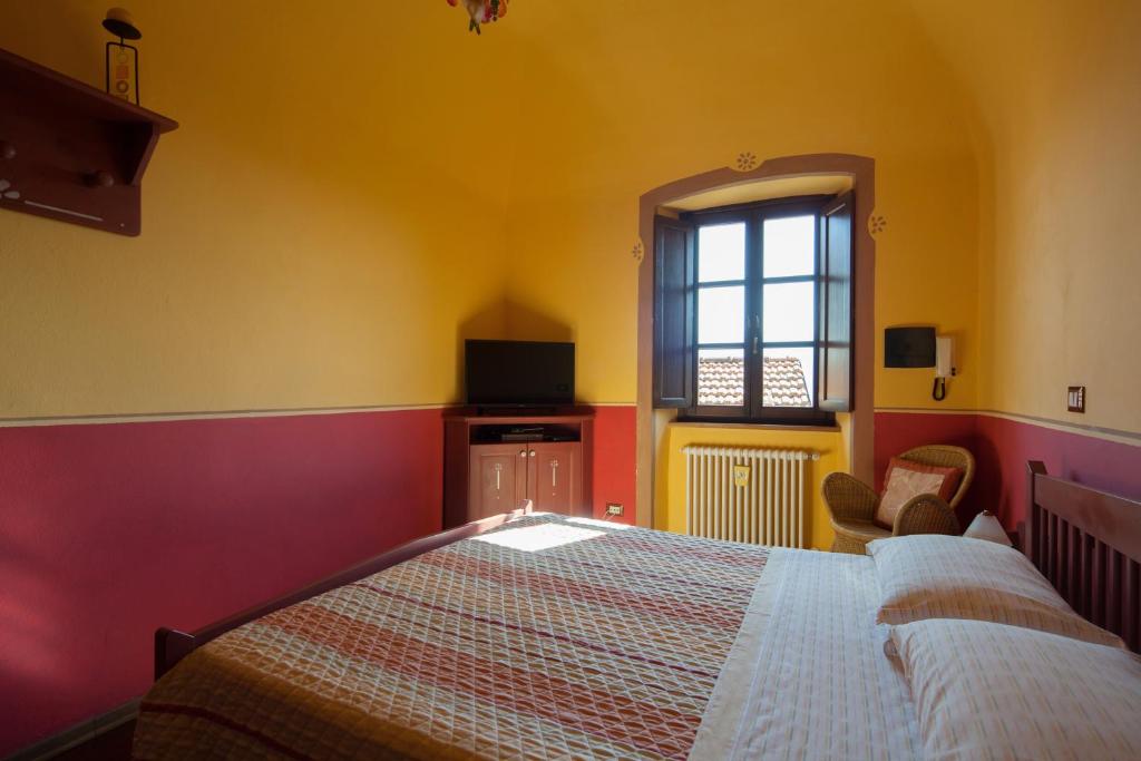 Postel nebo postele na pokoji v ubytování B&B La Pulce Dorata