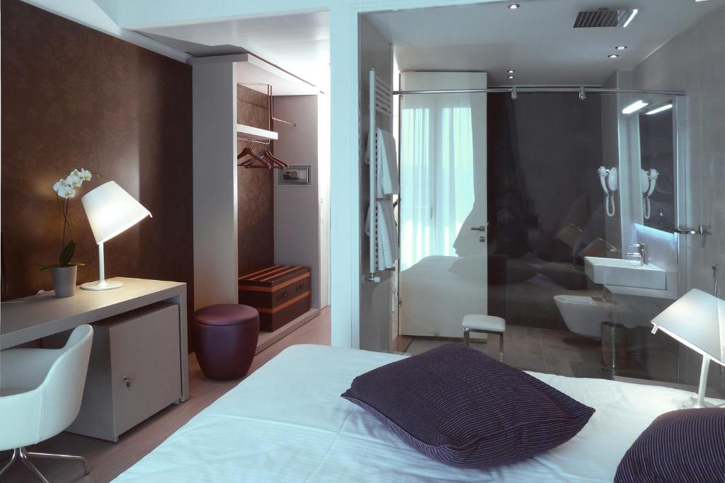Posteľ alebo postele v izbe v ubytovaní Hotel Lugano Torretta
