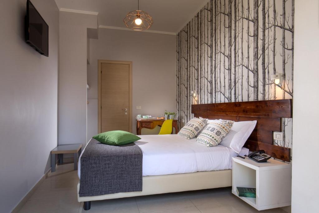 Postel nebo postele na pokoji v ubytování Urban Garden Hotel