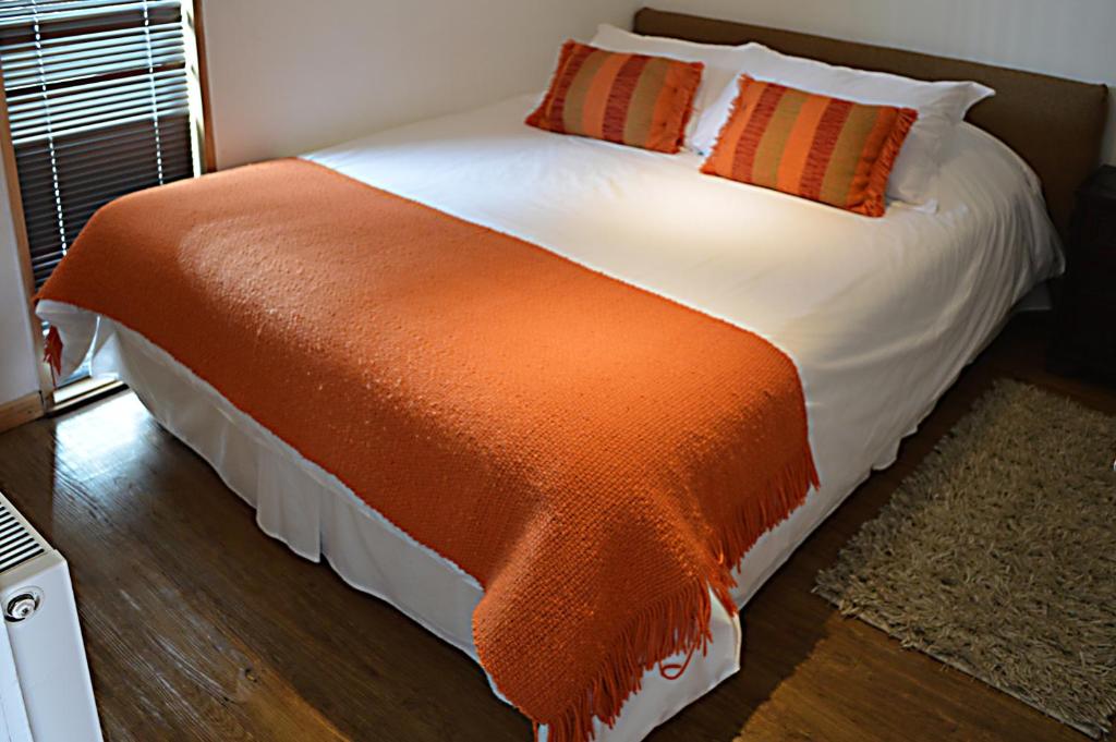 Postel nebo postele na pokoji v ubytování Apart Hotel Quillango