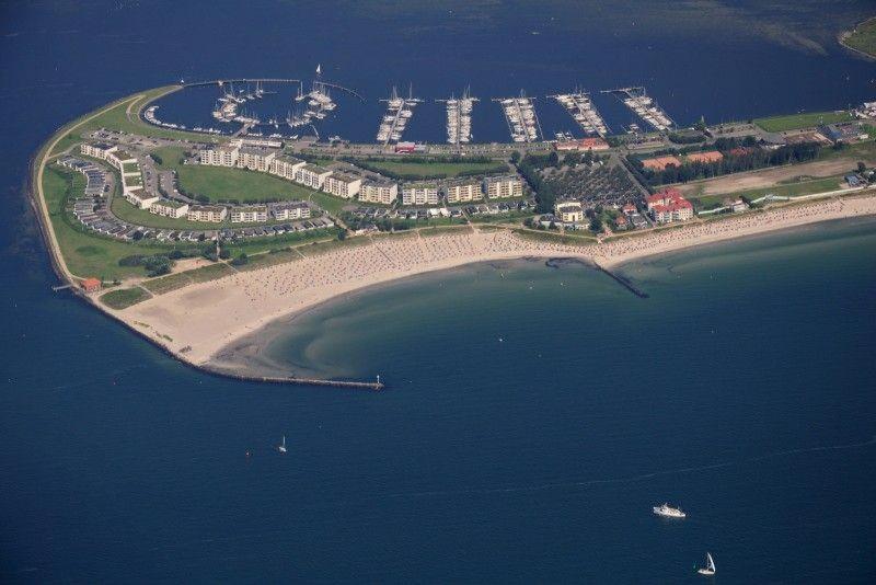 an aerial view of a beach with boats in the water at Direkt-am-Suedstrand in Burgtiefe auf Fehmarn 