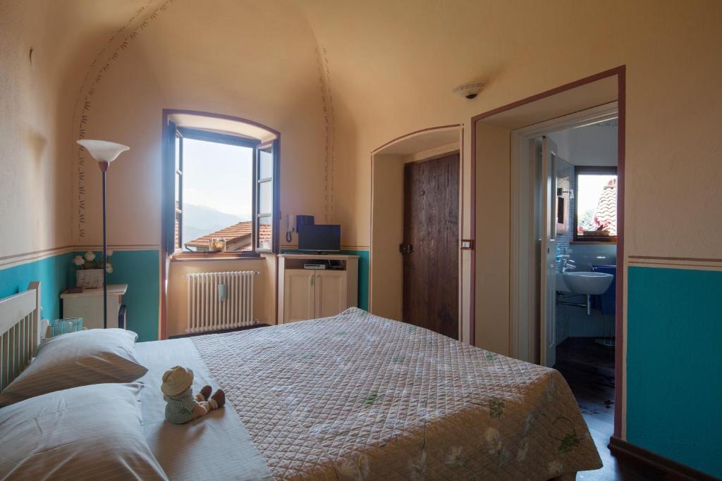 Postel nebo postele na pokoji v ubytování B&B La Pulce Dorata