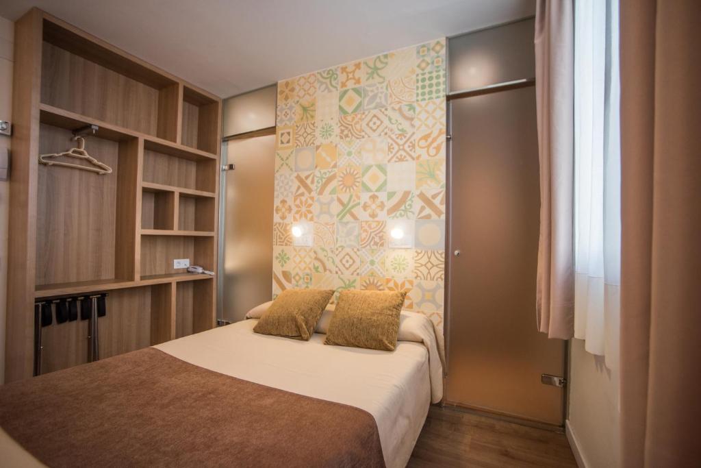 Posteľ alebo postele v izbe v ubytovaní Hostal Marenostrum