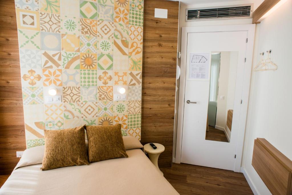 Posteľ alebo postele v izbe v ubytovaní Hostal Marenostrum