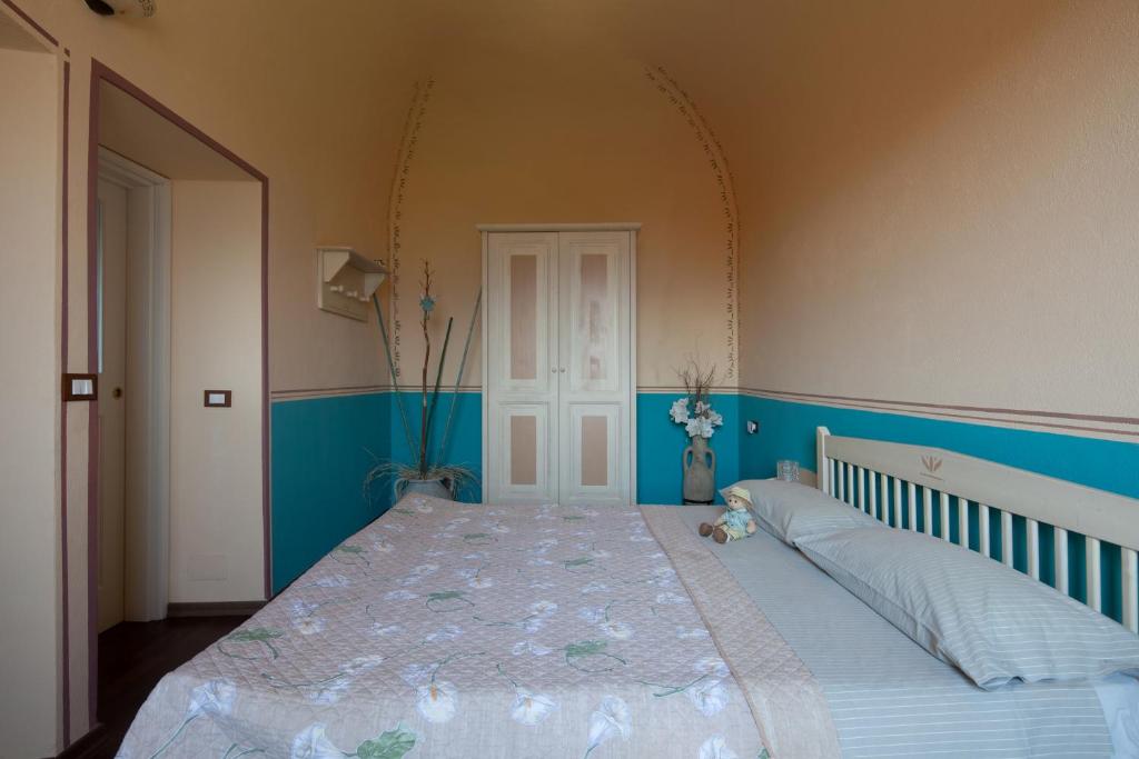 Postel nebo postele na pokoji v ubytování B&B La Pulce Dorata