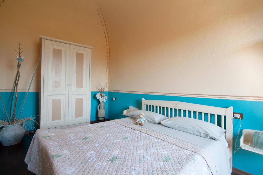 Postel nebo postele na pokoji v ubytování B&B La Pulce Dorata