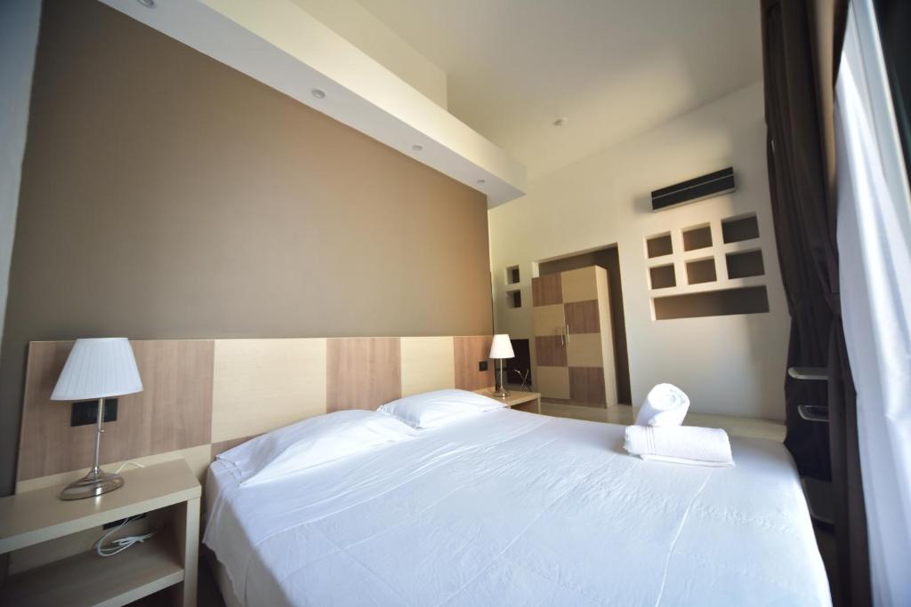 Postel nebo postele na pokoji v ubytování B&B Del Duomo