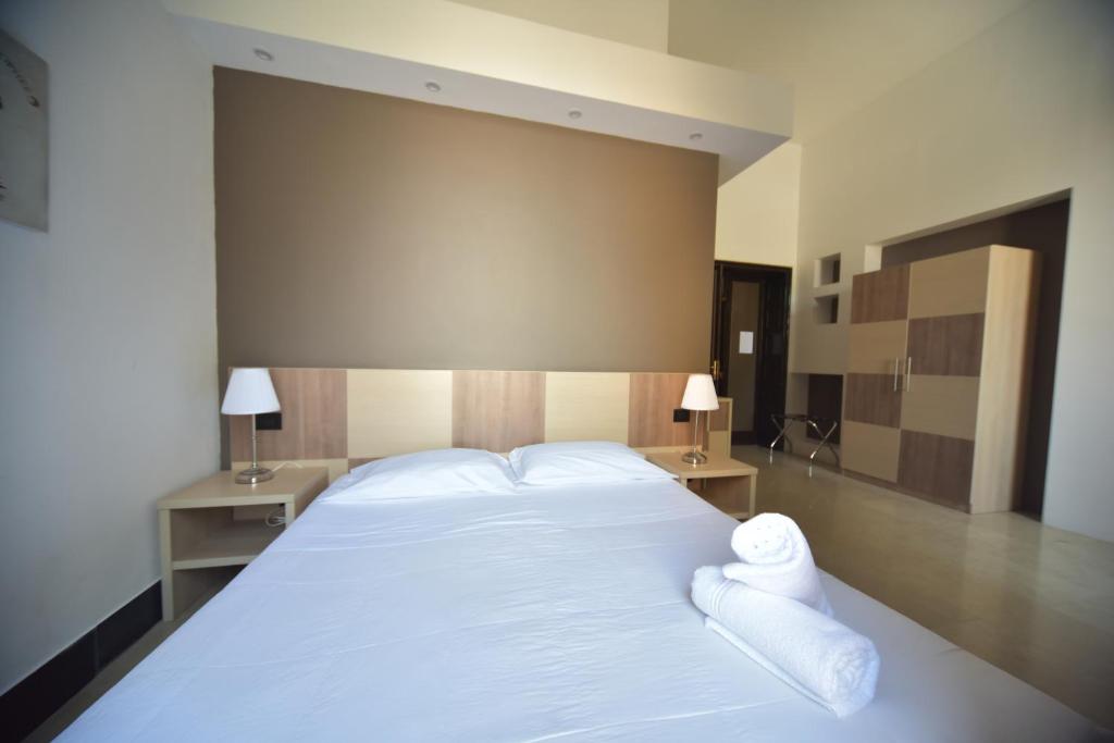 Postel nebo postele na pokoji v ubytování B&B Del Duomo