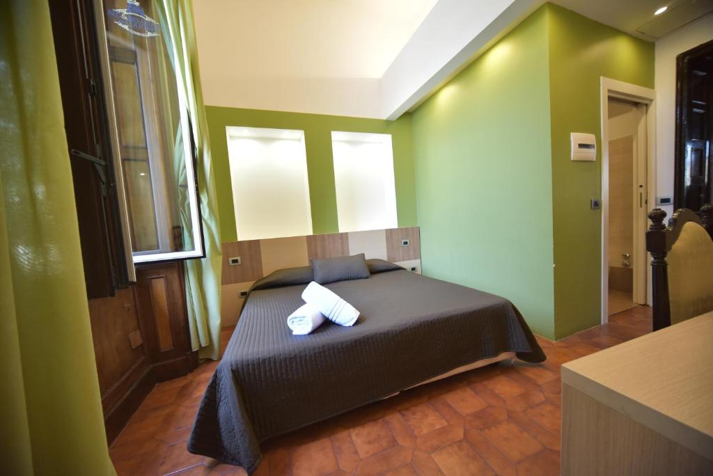 Postel nebo postele na pokoji v ubytování B&B Del Duomo