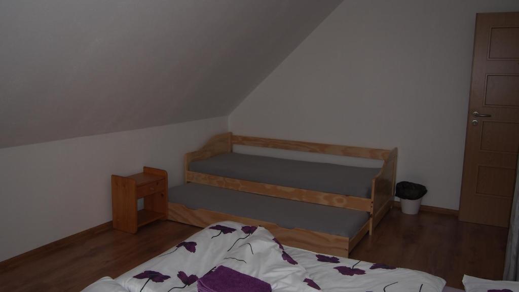 Postel nebo postele na pokoji v ubytování Penzion u Šimečků