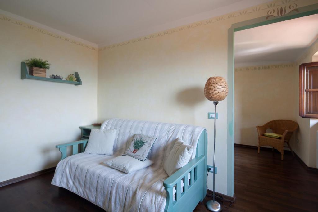 Postel nebo postele na pokoji v ubytování B&B La Pulce Dorata